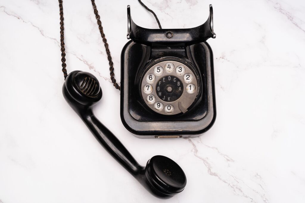 Old telephone, black, We listen, call us